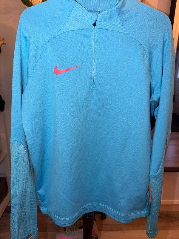Nike blá hálfrennd peysa